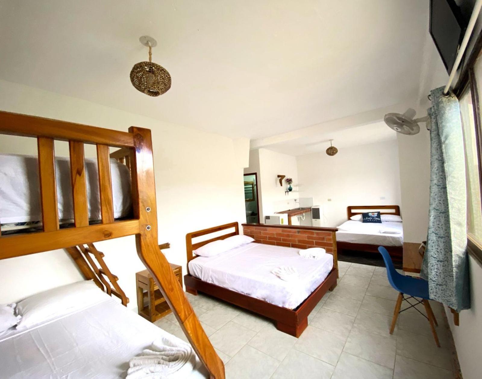 Whale House Hotel ปูแอร์โตโลเปซ ห้อง รูปภาพ